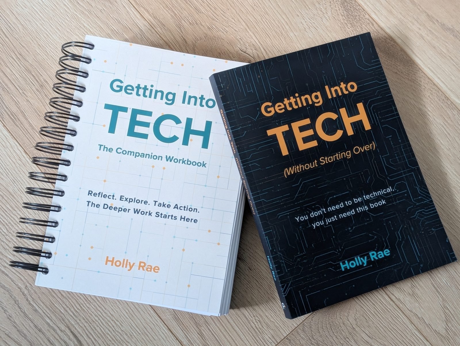 The paperback book and spiral-bound workbook side by side