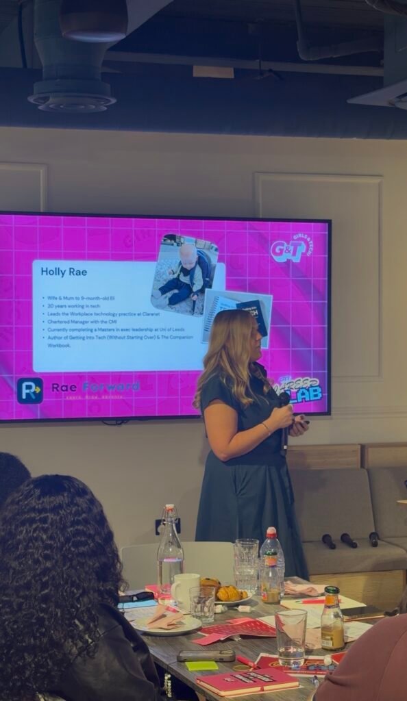 Holly Rae speaking to the room at the Girls and Tech of Tomorrow Career Lab, with her presentation on the screen behind her