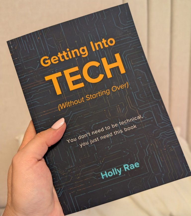 GETTING INTO TECH BOOK a left hand holding the dark cover book of getting into tech (without starting over)